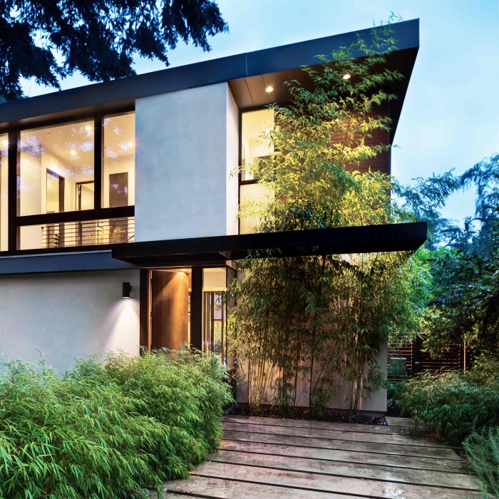 House in modern architecture with the lights on