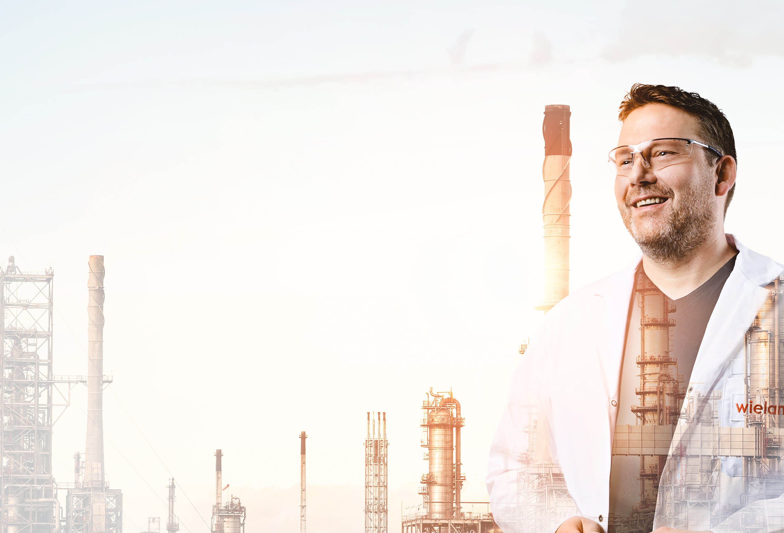 Surface engineer Richard with factory in the background