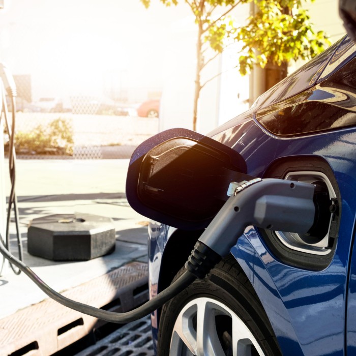 Electric car plugged to a loading station