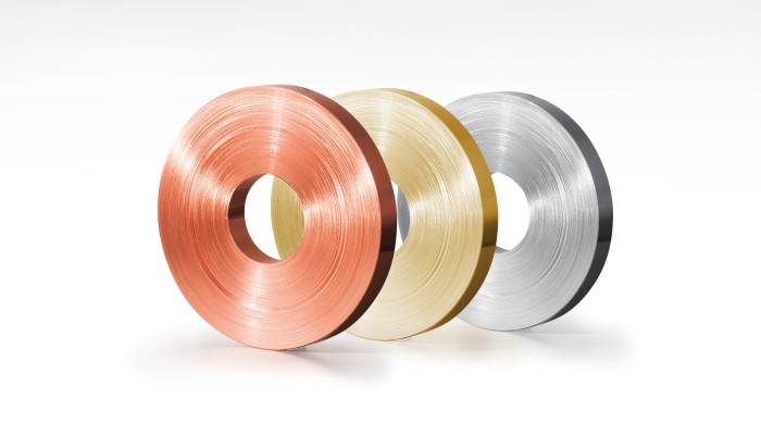 Three types of rolled strip, copper, brass and aluminium