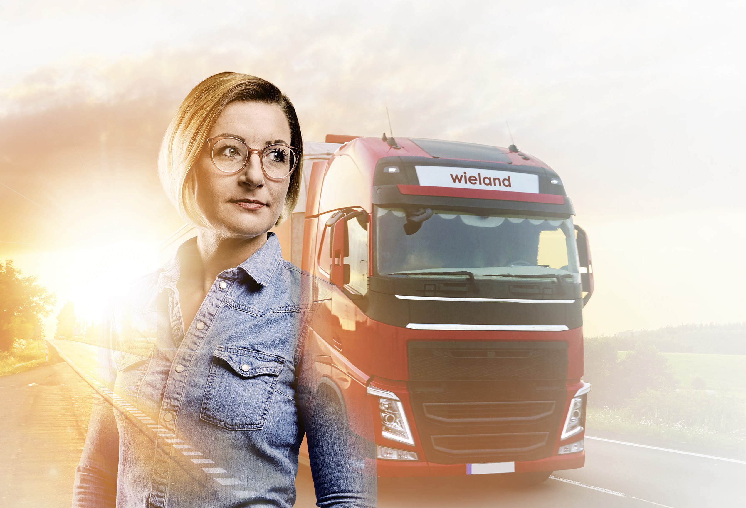 Sales employee Rilana with Wieland truck on the road in the background
