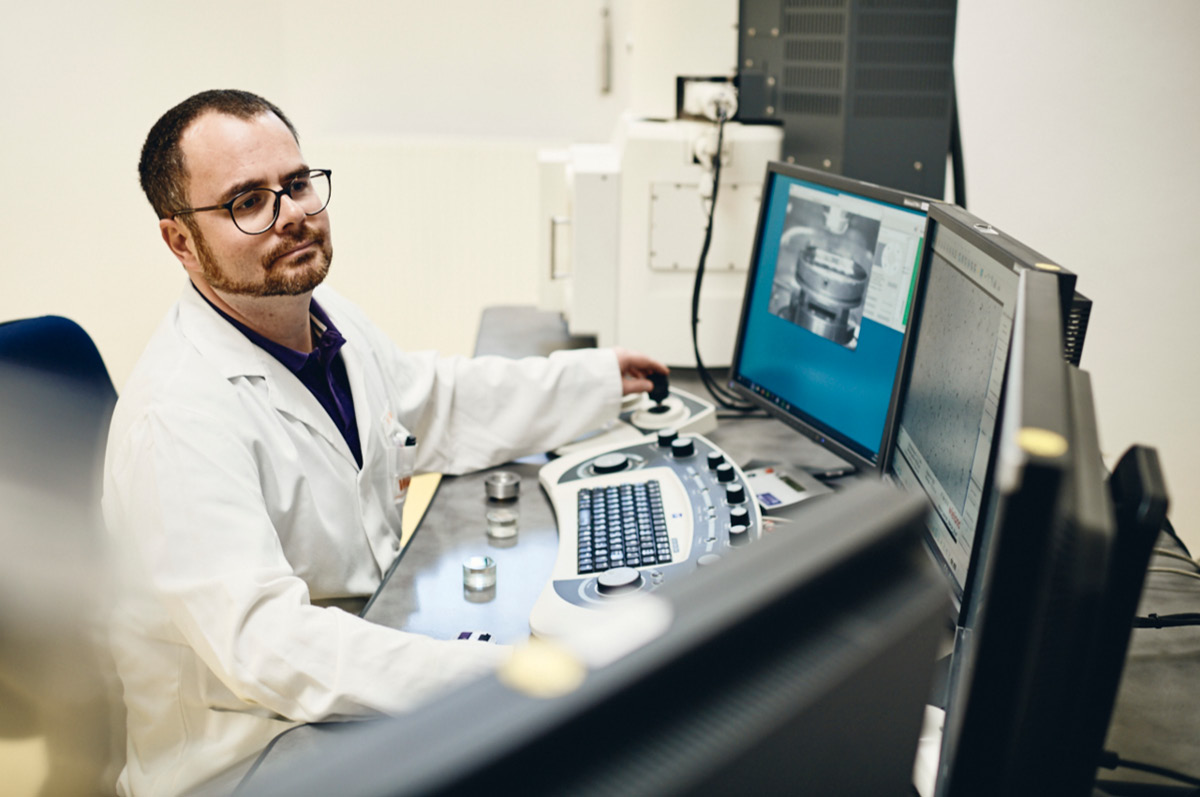 Material scientit sitting in front of a computer